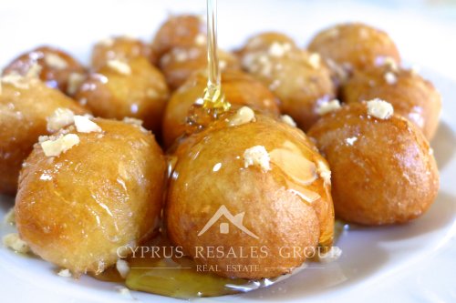 Loukoumades are sweet little balls of dough drizzled with honey and then sprinkled with cinnamon.