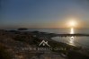 Sunset over Yeronissos island off the coast of St George in Peyia, Cyprus